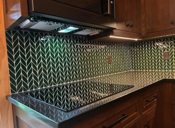 Emerald green herringbone backsplash